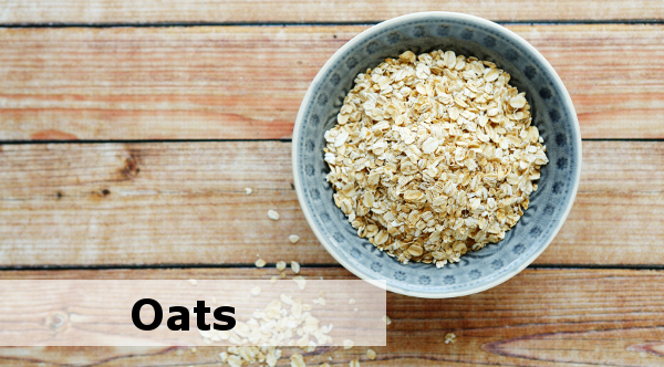 flakes in a bowl on wooden background, food closeup